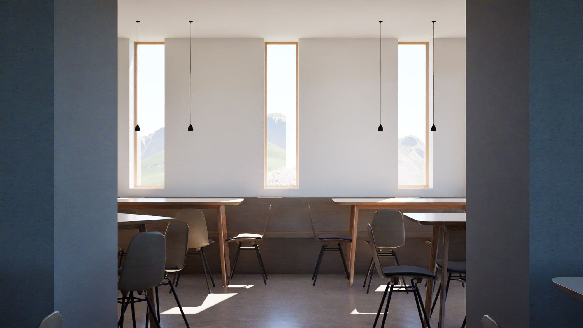 Rifugio Zeno Colò: sala bar dal design minimale con tavoli in legno chiaro